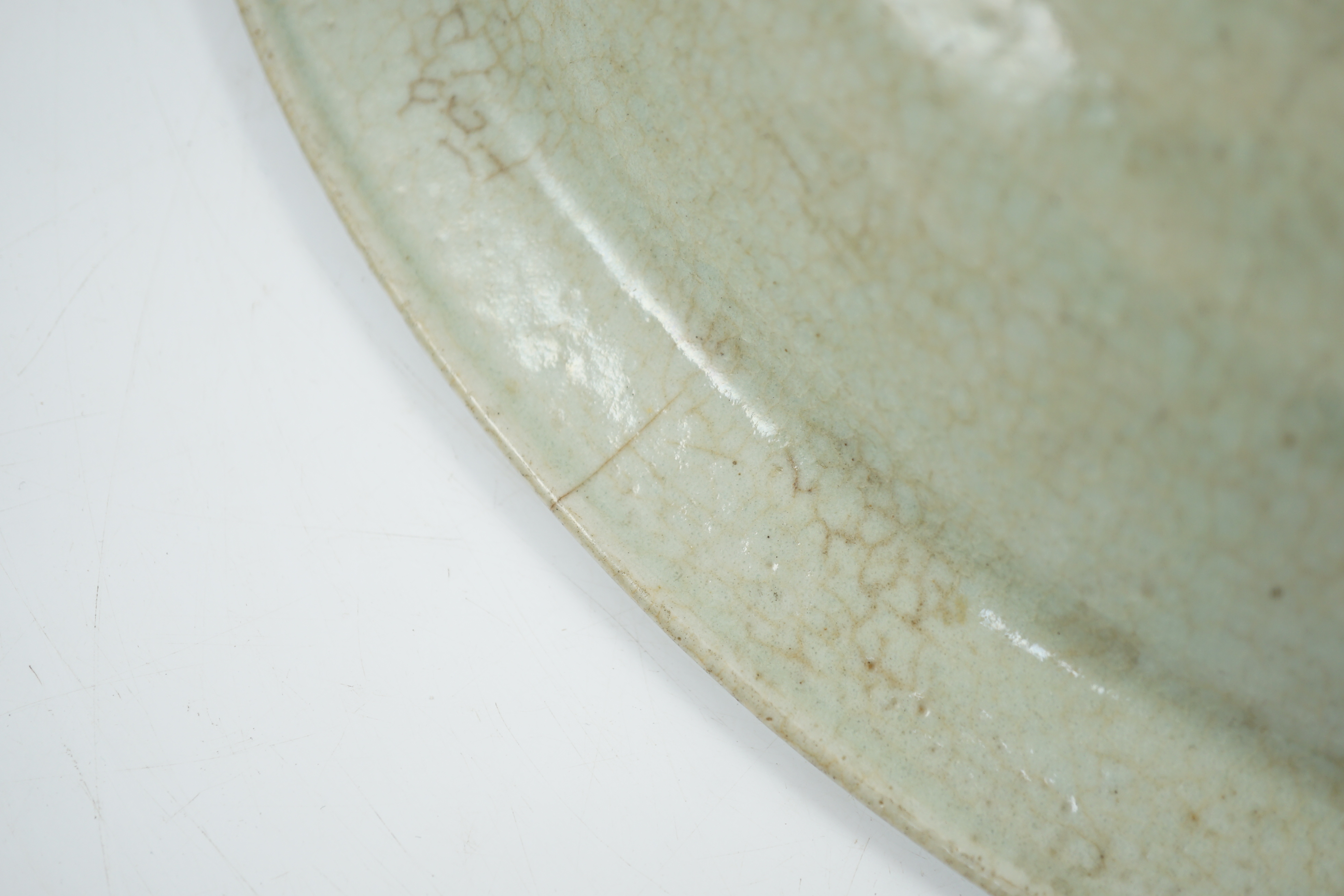 A Chinese Longquan celadon dish, Yuan-Ming dynasty, 13th/14th century, some faults